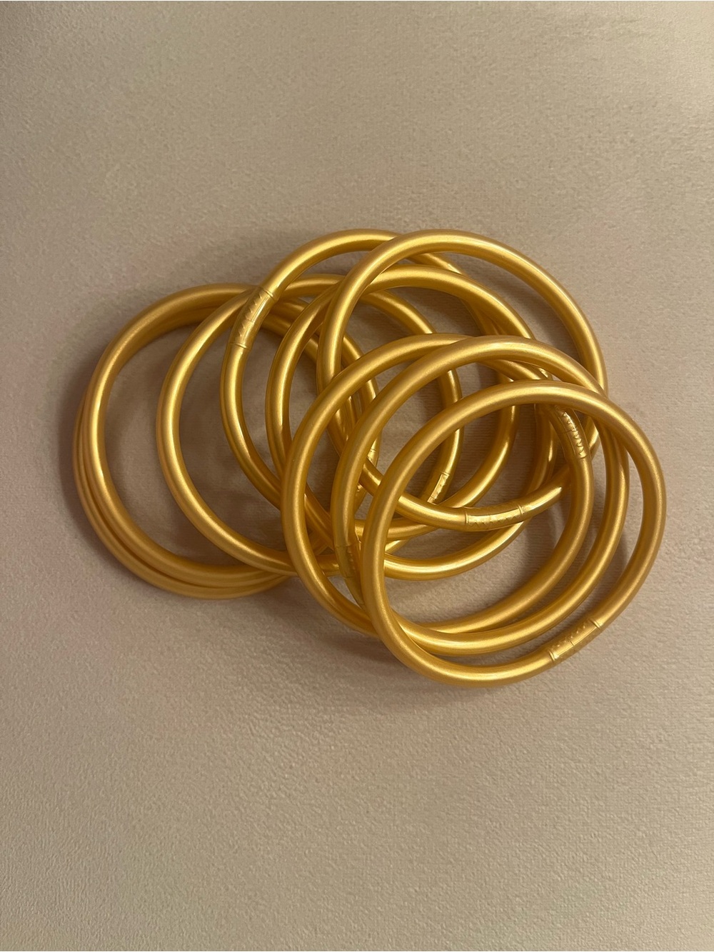 Set of 9 gold bangle bracelets